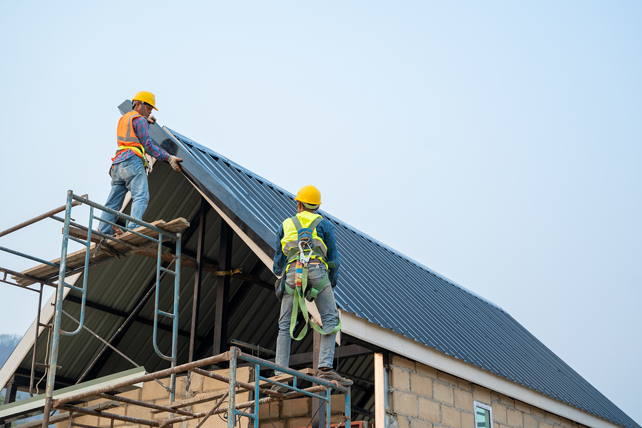 men working the roof