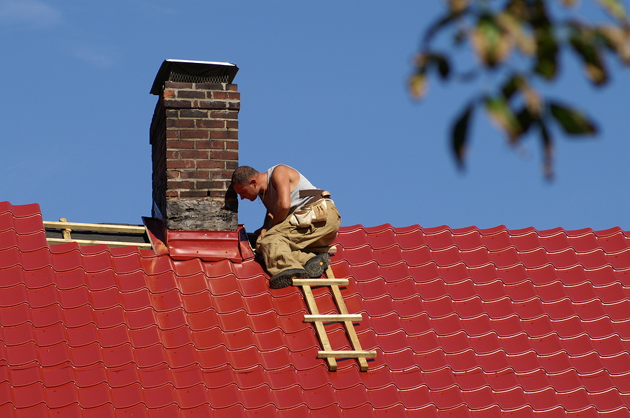 man checking the roof